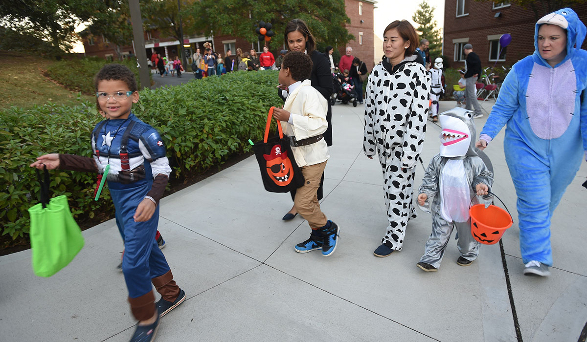 Children trick-or-treating on campus